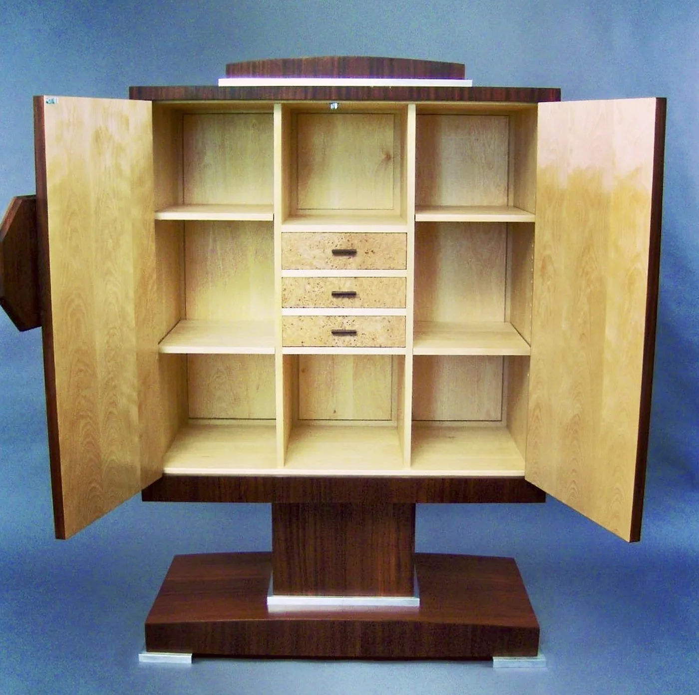 Custom-built cabinet with handcrafted interior compartments by Rew Construction in Coeur d'Alene, ID