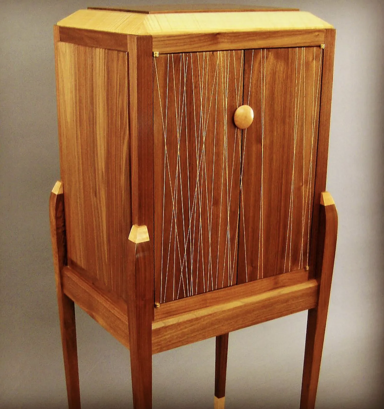 Handcrafted standing cabinet with custom joinery by Rew Construction in North Idaho
