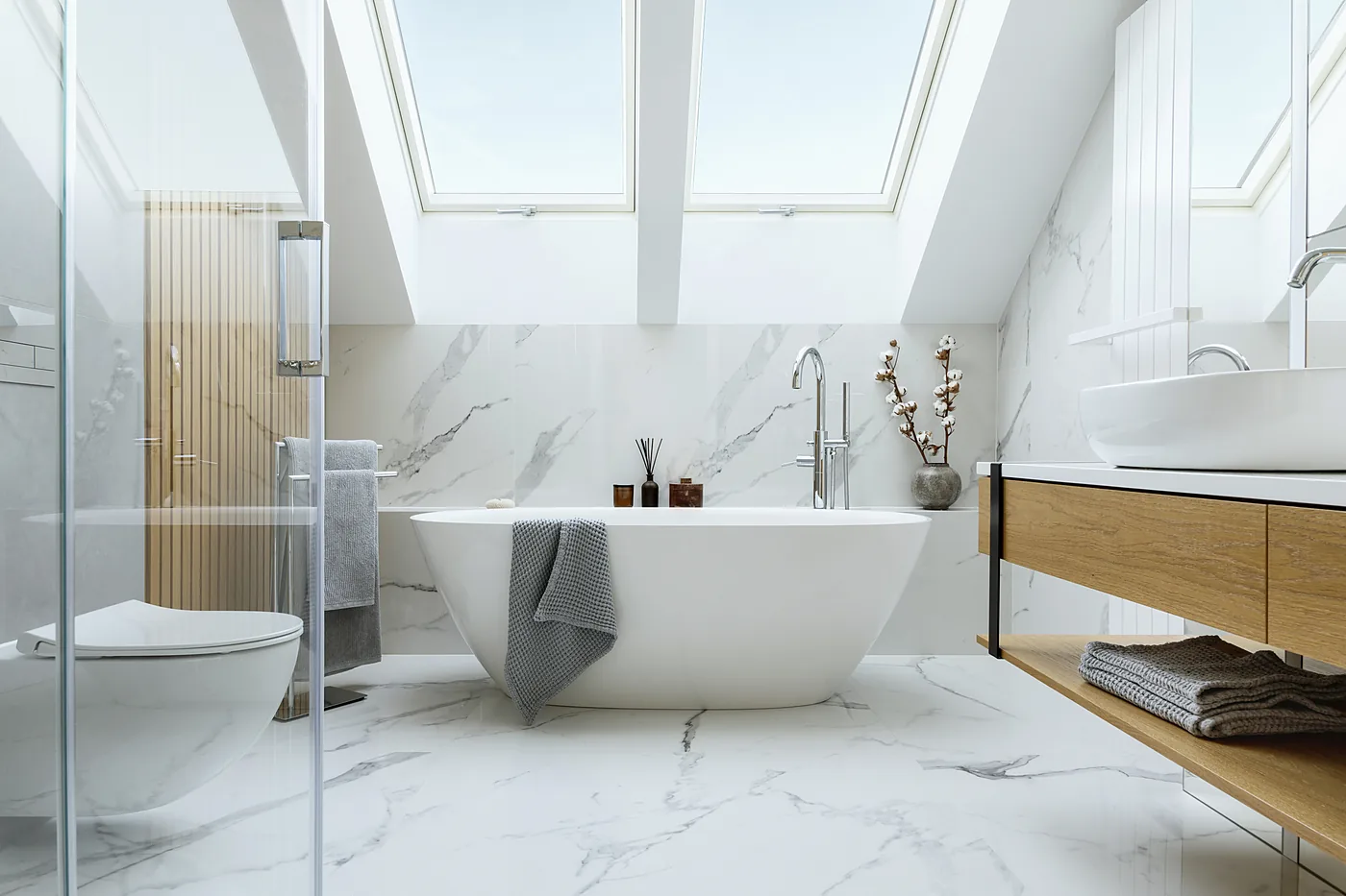 Modern bathroom remodel with freestanding tub and custom wood vanity in Coeur d'Alene, ID