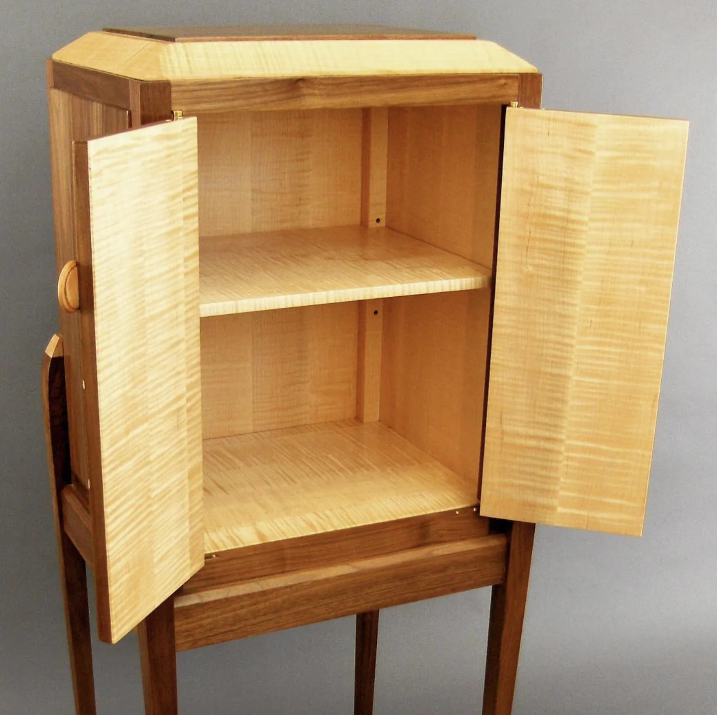 Walnut cabinet with curly maple interior and hand-fitted doors by Rew Construction
