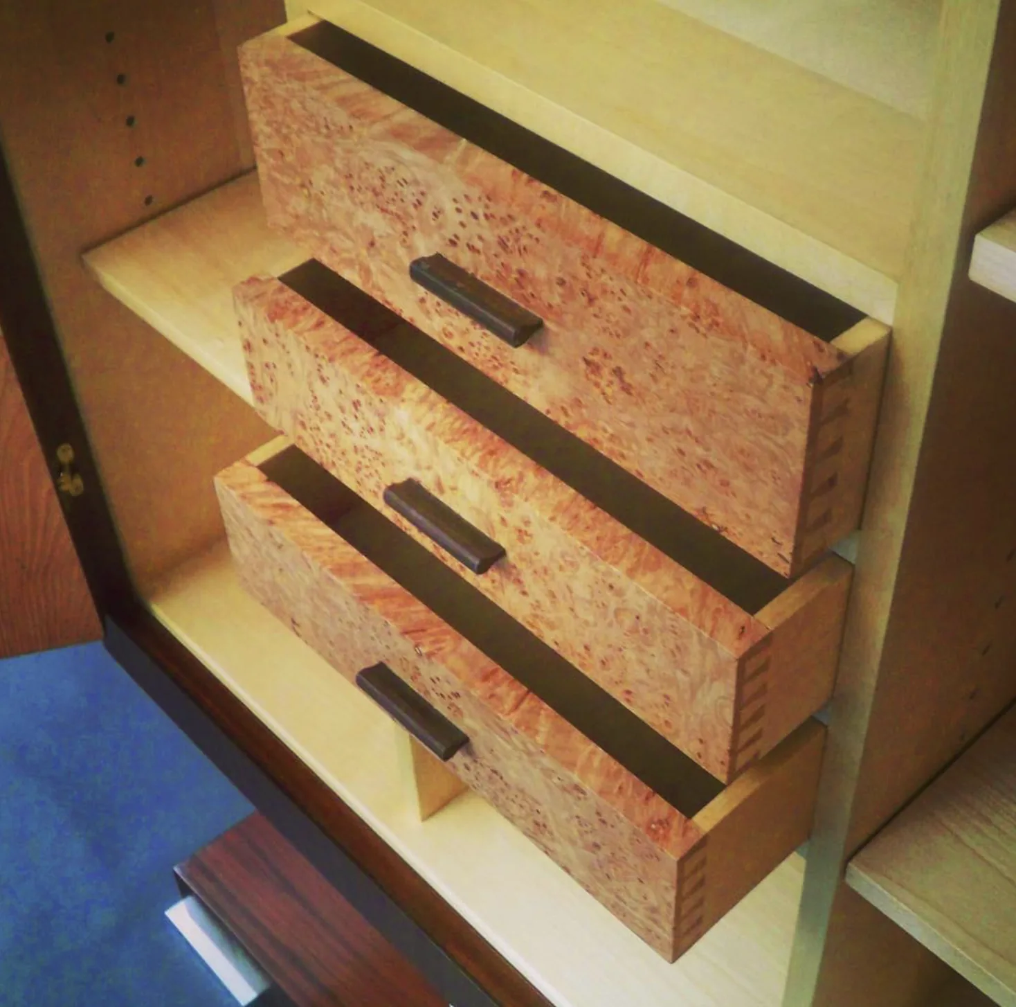 Dovetailed birdseye maple drawers, hand-cut joinery detail by Rew Construction