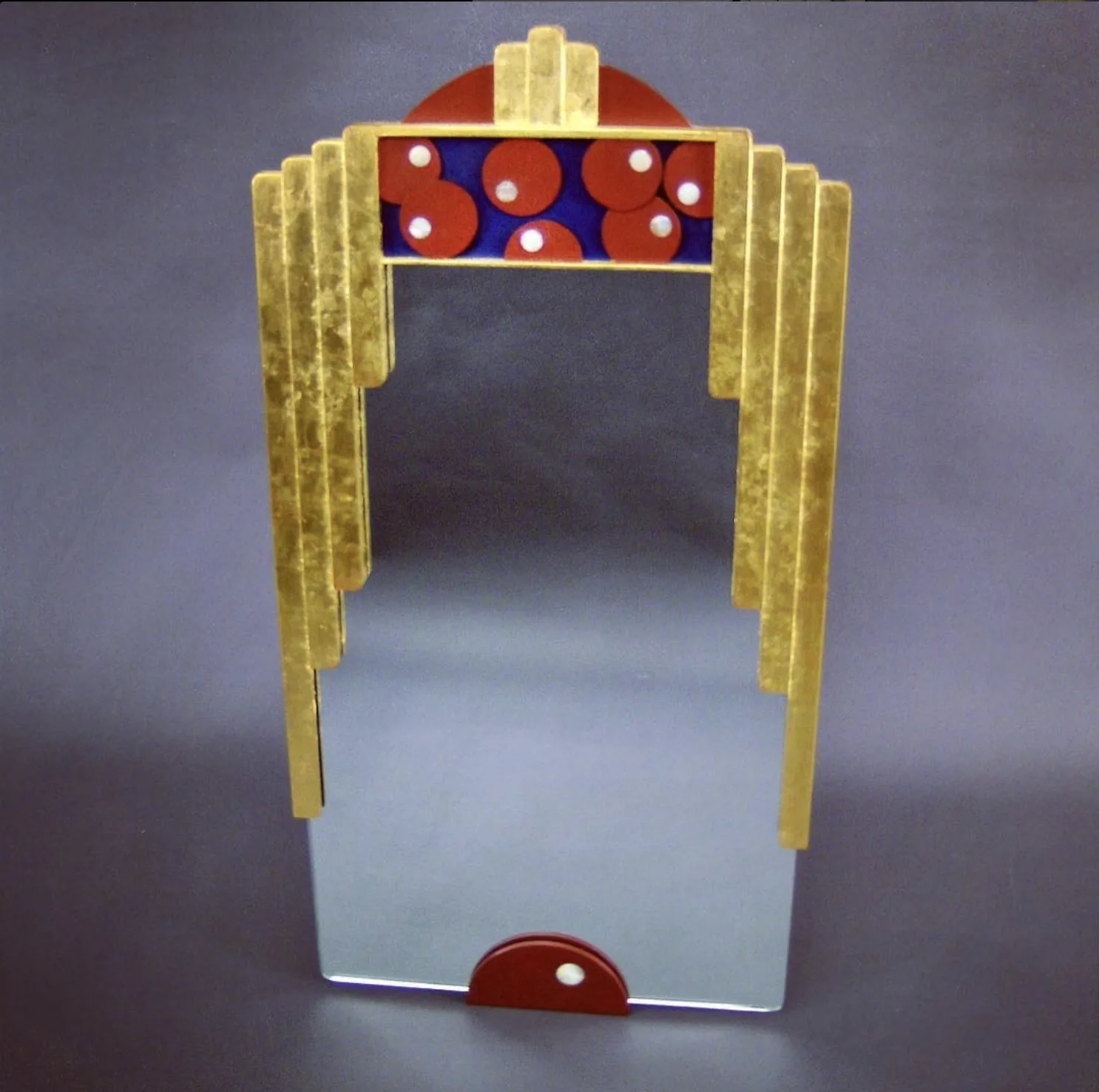 Art deco gold-leaf mirror with stepped frame and lacquered red and blue inlay panel, handcrafted by Rew Construction